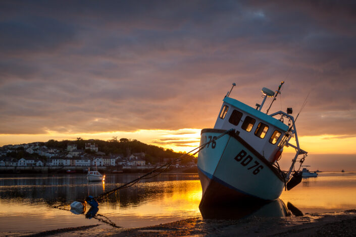 Fishing Boat, Instow, Devon at sunset by David Anderson